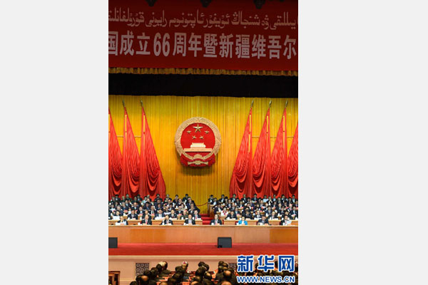 10月1日，慶祝中華人民共和國成立66周年暨新疆維吾爾自治區成立60周年大會在新疆人民會堂隆重舉行。 新華社記者 高潔 攝 